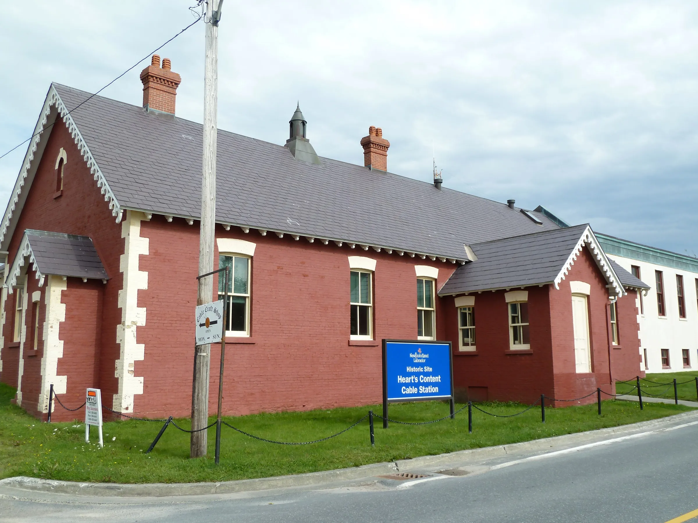The Heart's Content Cable Station, a long white clapboard building on the shore where the first working transatlantic telegraph cable came ashore.